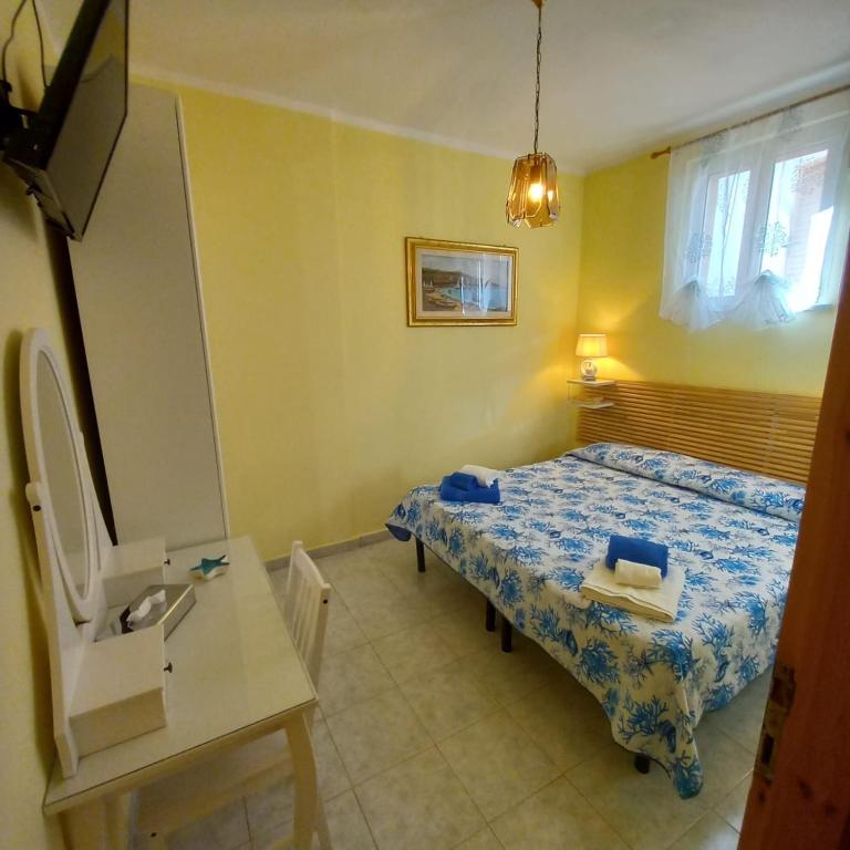 Postel nebo postele na pokoji v ubytování Hotel Calabattaglia