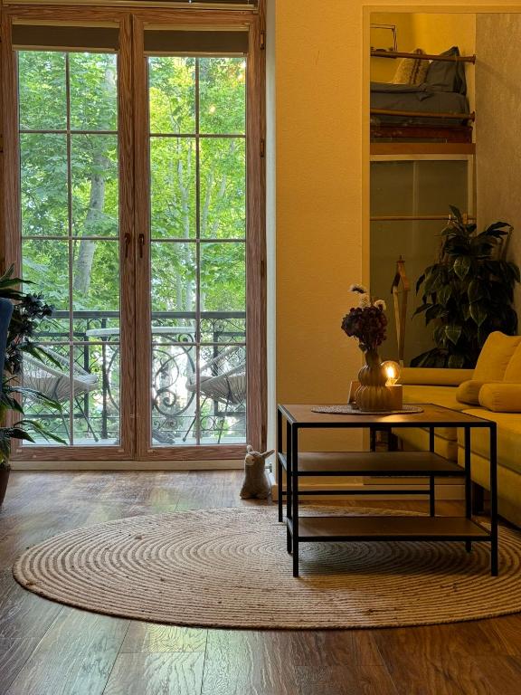 a living room with a couch and a coffee table at Zimmer Boutique Hotel in Baku