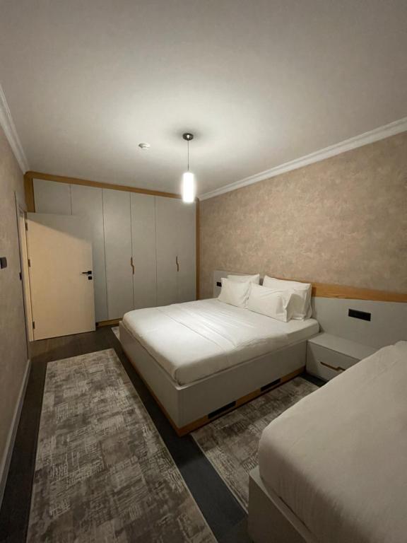 Postel nebo postele na pokoji v ubytování Apartament Koha