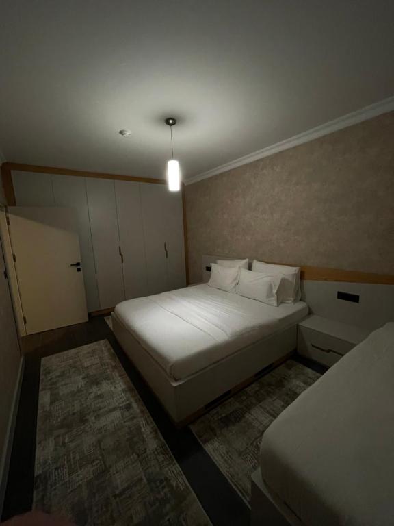 Postel nebo postele na pokoji v ubytování Apartament Koha