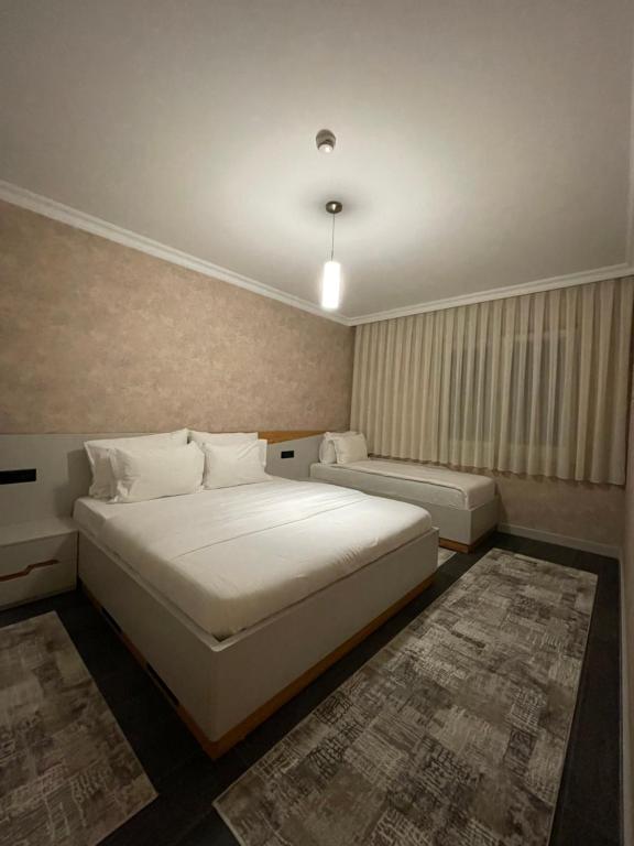 Postel nebo postele na pokoji v ubytování Apartament Koha