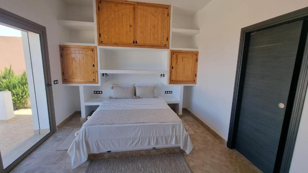 Postel nebo postele na pokoji v ubytování Villa avec piscine Asilah, terrain de foot privative