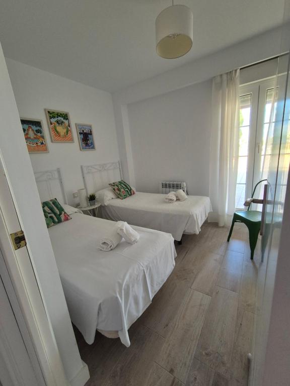 Postel nebo postele na pokoji v ubytování TOP APARTMENT! Frente al mar y gran terraza