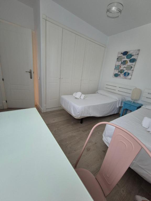 Postel nebo postele na pokoji v ubytování TOP APARTMENT! Frente al mar y gran terraza