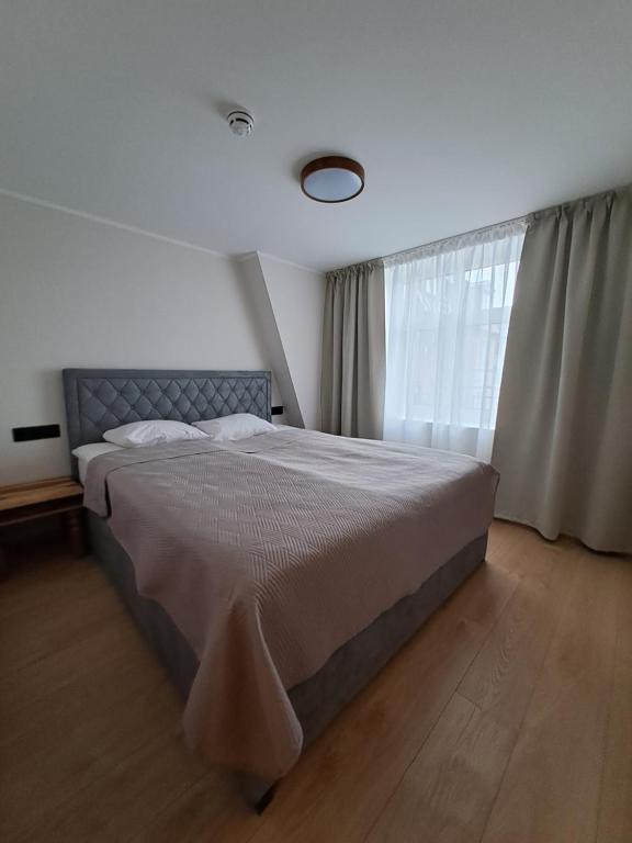Postel nebo postele na pokoji v ubytování Suur-Posti Apartments