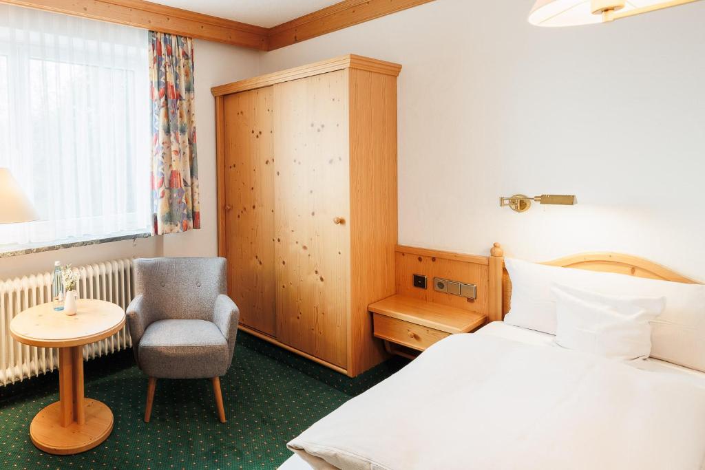 Postel nebo postele na pokoji v ubytování Boutiquehotel Ochsen