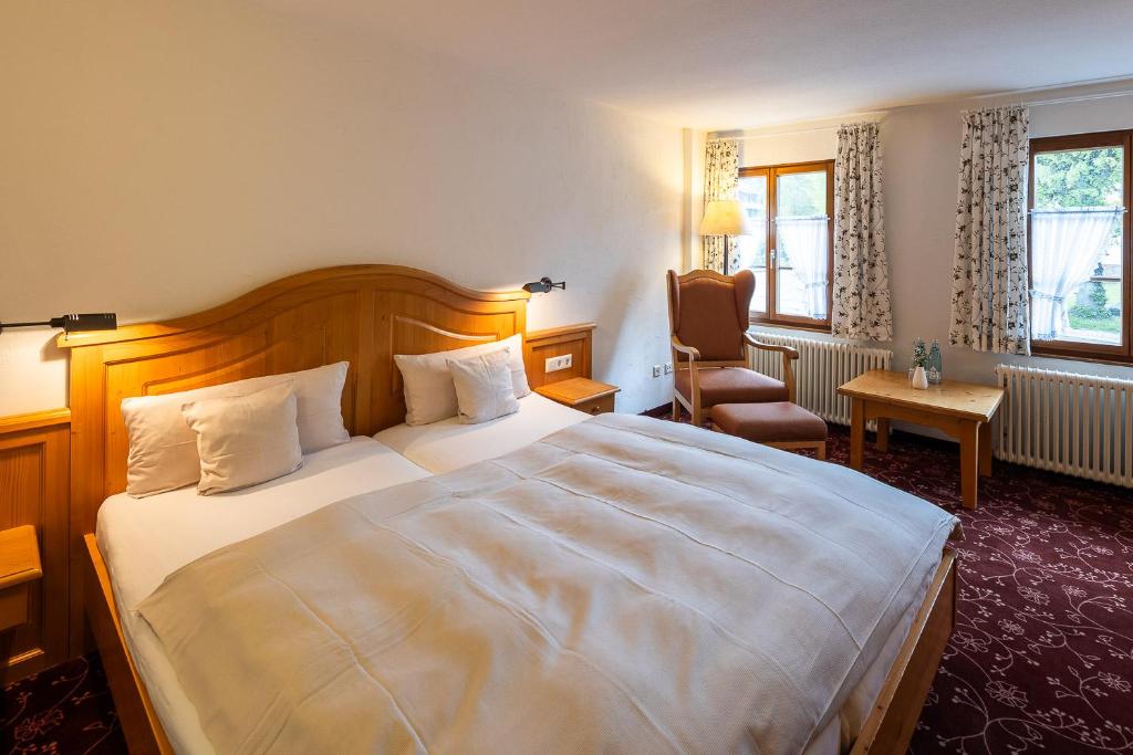 Postel nebo postele na pokoji v ubytování Boutiquehotel Ochsen