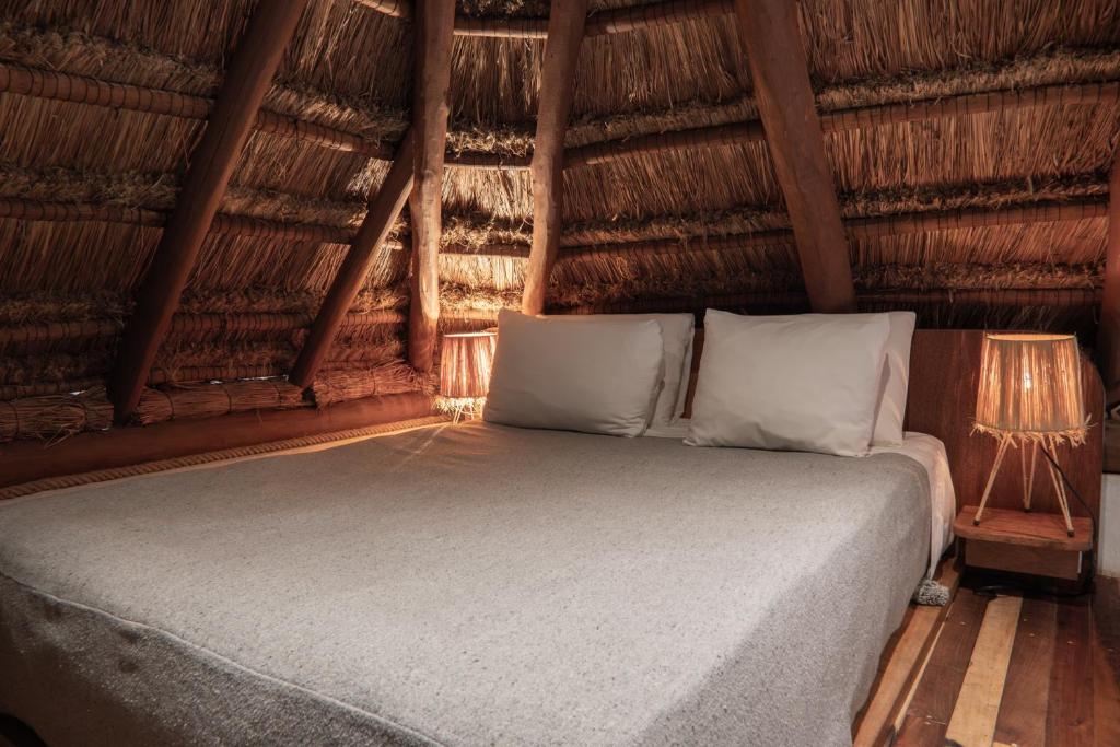 Postel nebo postele na pokoji v ubytování Hotel Casa Hormiga