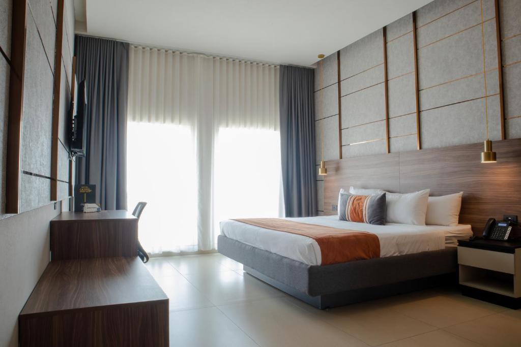 Postel nebo postele na pokoji v ubytování Grand Hotel&Casino Vía Dorada