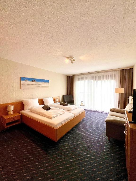 Postel nebo postele na pokoji v ubytování Kirchspielkrug Landhotel & Restaurant