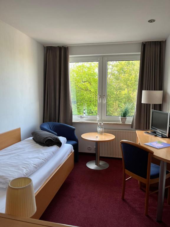 Postel nebo postele na pokoji v ubytování Kirchspielkrug Landhotel & Restaurant