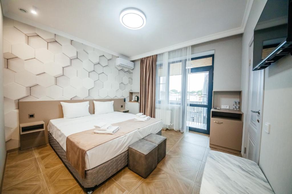 Postel nebo postele na pokoji v ubytování Chief Hotel