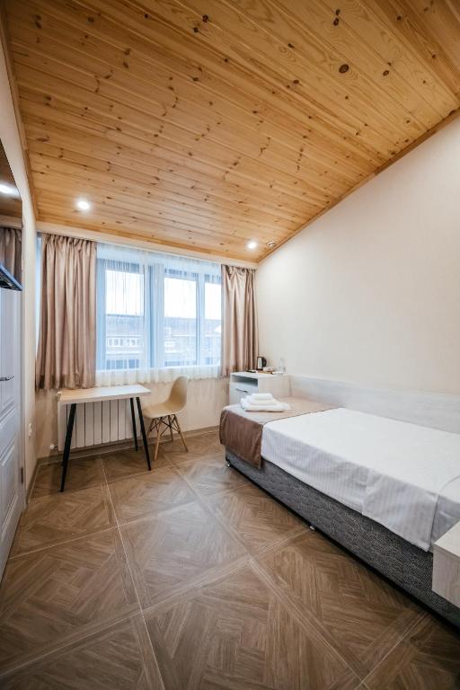 Postel nebo postele na pokoji v ubytování Chief Hotel