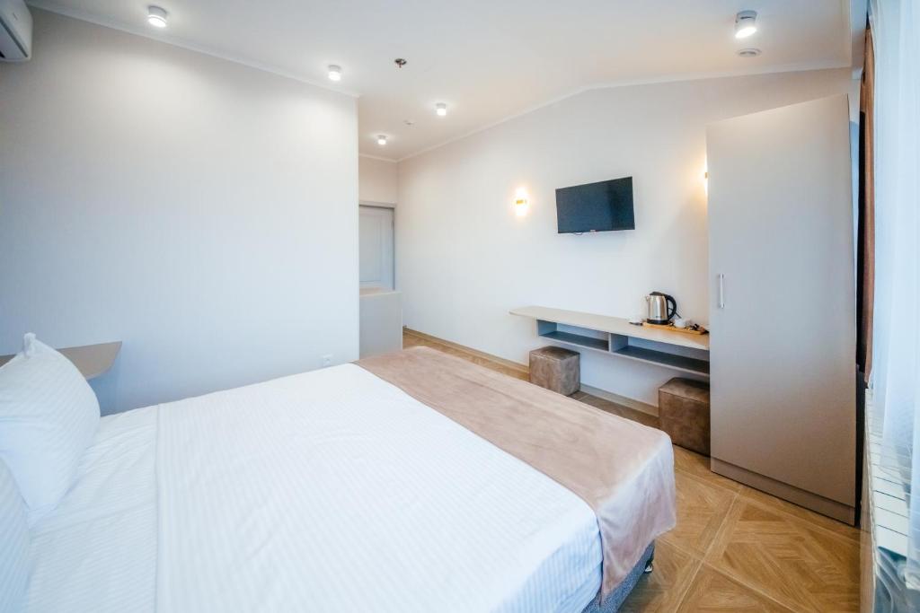 Postel nebo postele na pokoji v ubytování Chief Hotel