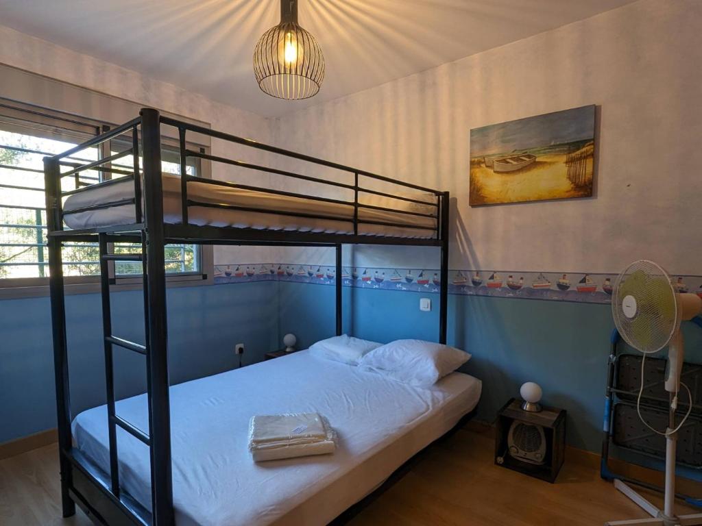 Postel nebo postele na pokoji v ubytování Au petit bonheur