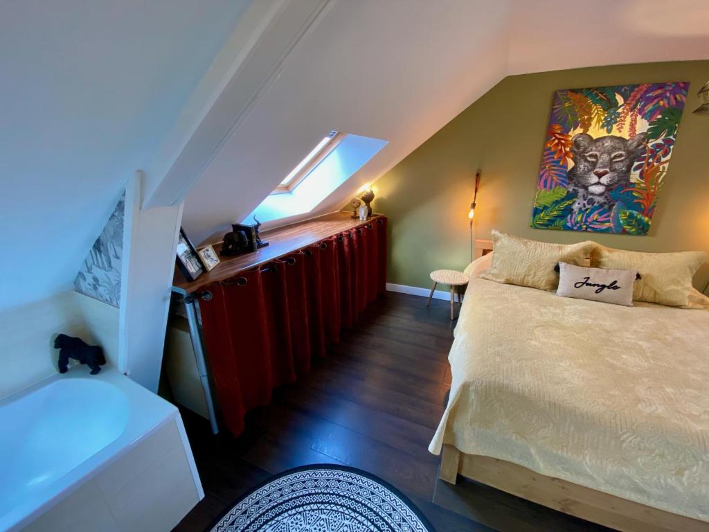 Postel nebo postele na pokoji v ubytování Le Clos de la Chapelle Bayeux