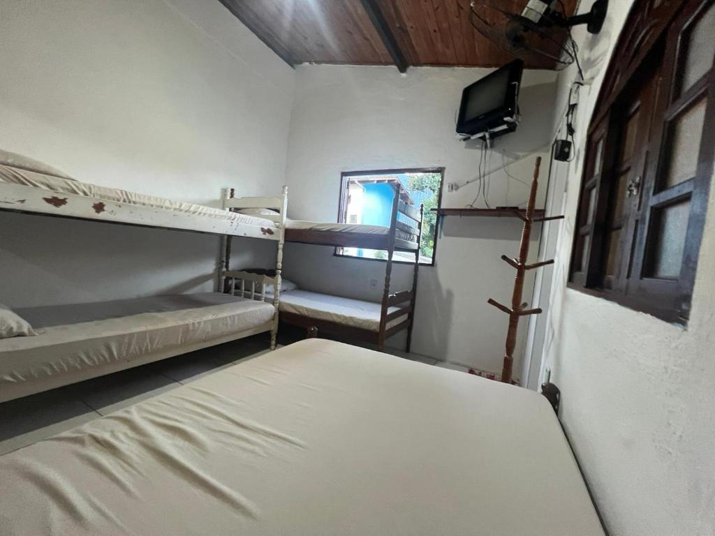 Postel nebo postele na pokoji v ubytování Toca do Pato Pousada