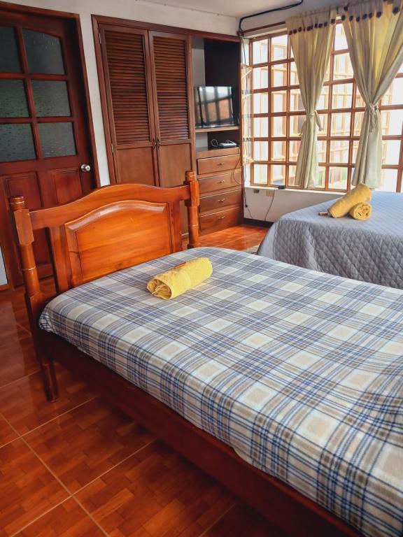 Postel nebo postele na pokoji v ubytování Chez Alicia Hostal