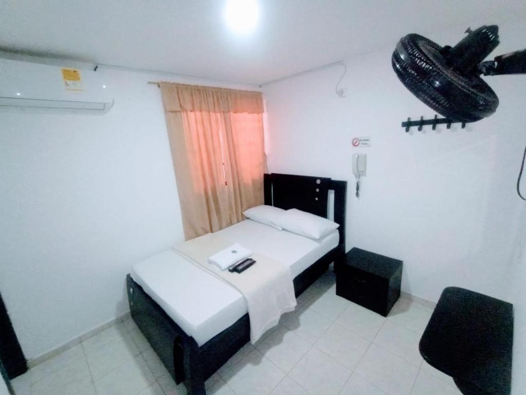 Postel nebo postele na pokoji v ubytování Hotel Jahdai Curumani