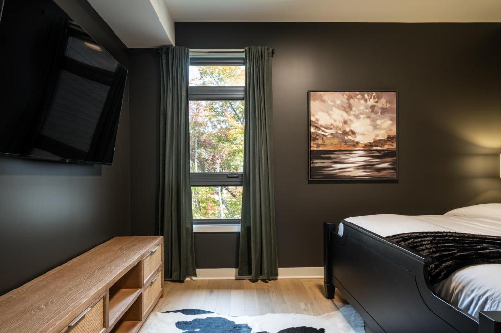 Postel nebo postele na pokoji v ubytování Tremblant Prestige - Verbier 8-202