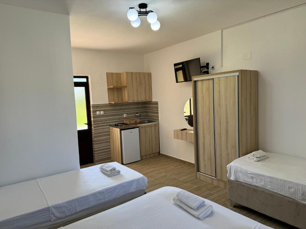 Postel nebo postele na pokoji v ubytování Niki Apartments