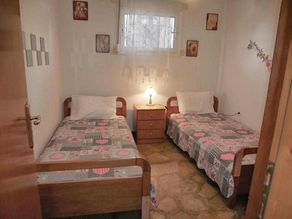 Postel nebo postele na pokoji v ubytování Paradiso Apartments with sea view