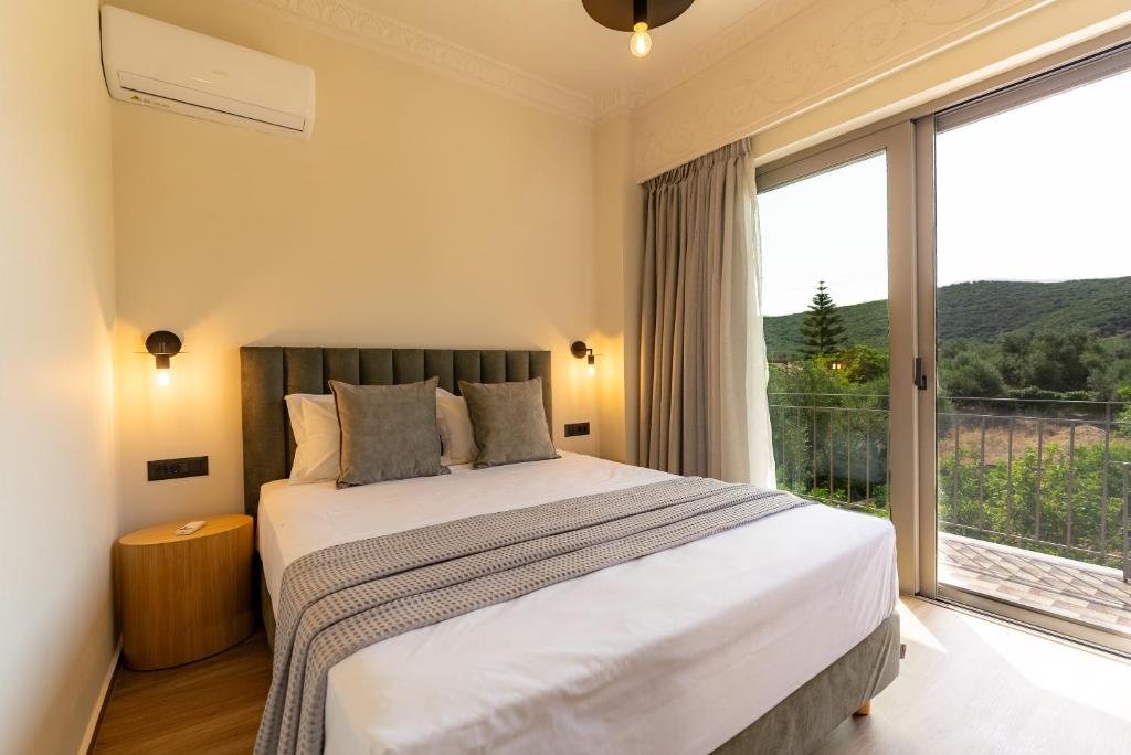 Postel nebo postele na pokoji v ubytování ITHACA Residence