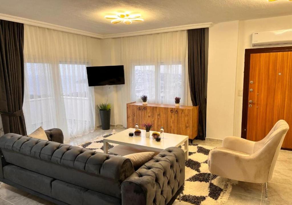 A television and/or entertainment centre at Bodrum eaSon Villa & House 350m2 Full Sea View with Private Infinity Pool