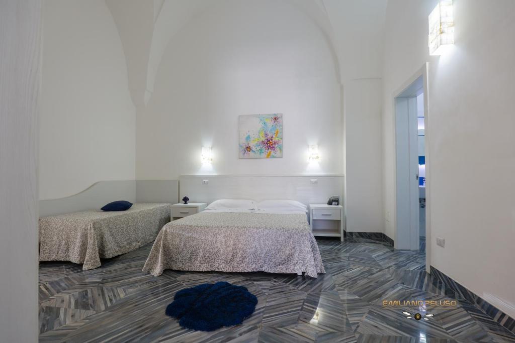 A bed or beds in a room at Casa Alfieri"rooms and Apartments"
