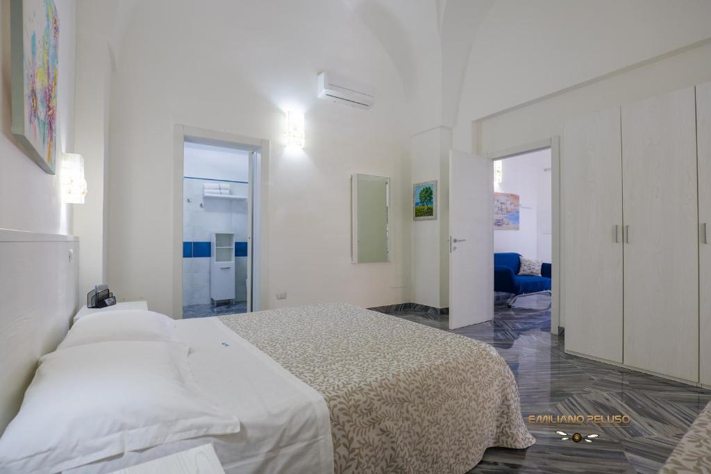 A bed or beds in a room at Casa Alfieri"rooms and Apartments"
