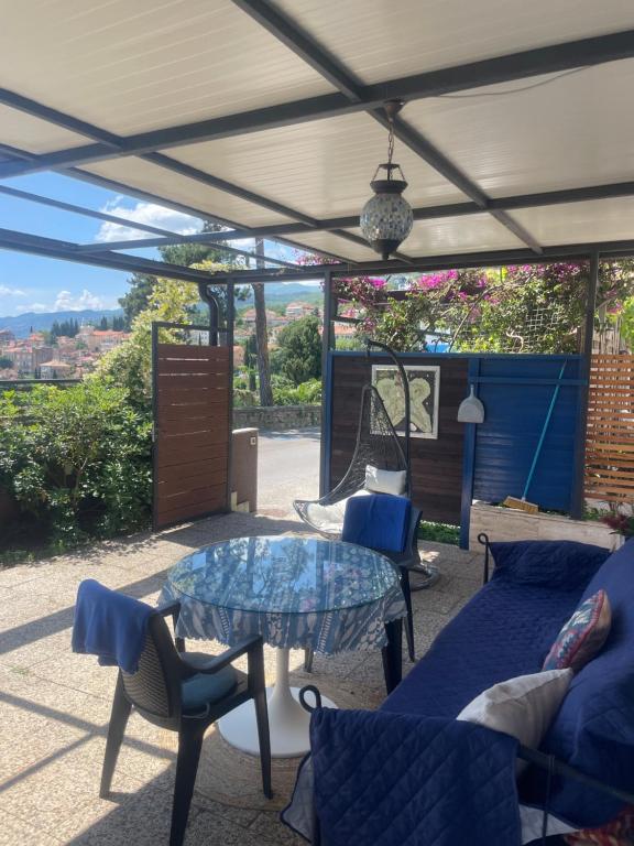 a patio with a table and chairs and a view at Apartments Villa Dinka in Opatija