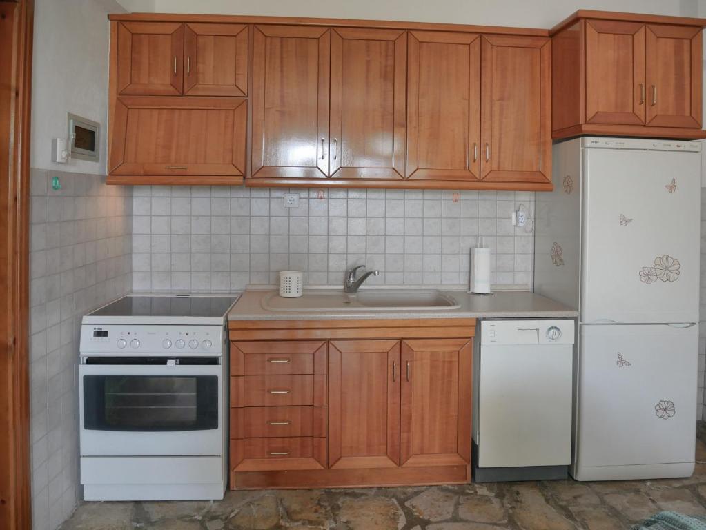 Kuchyň nebo kuchyňský kout v ubytování Paradiso Apartments with sea view
