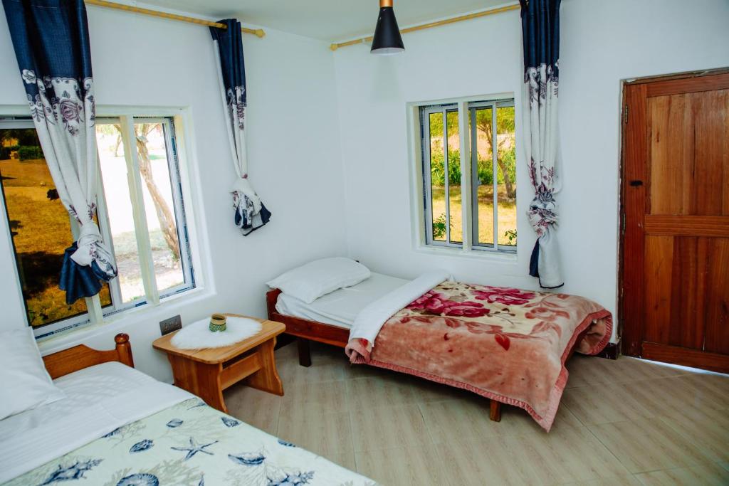 Ένα ή περισσότερα κρεβάτια σε δωμάτιο στο Gangilonga Home's