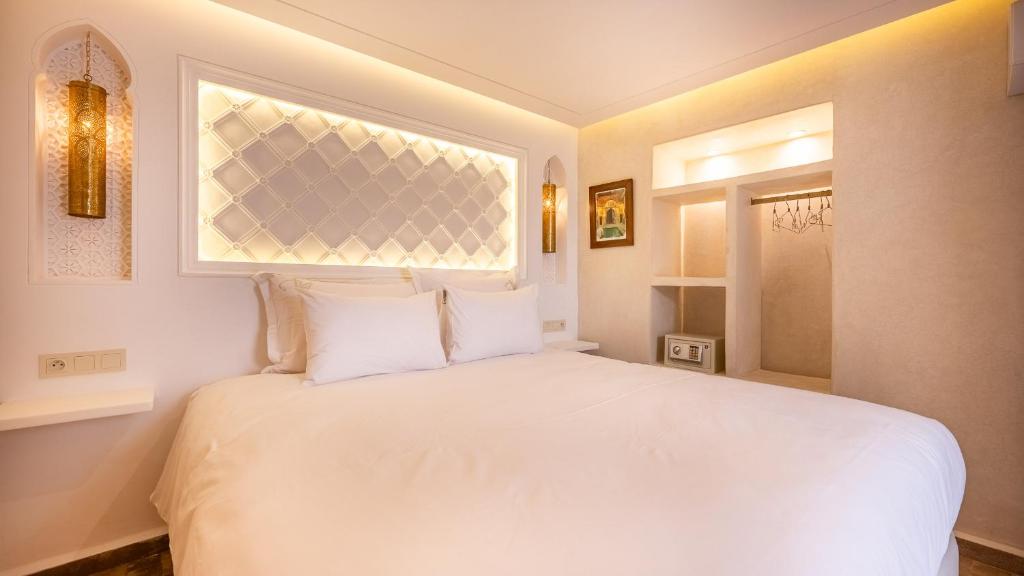 Postel nebo postele na pokoji v ubytování Luxe Nomade Marrakech & Spa