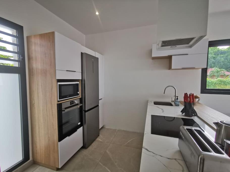 Kuchyň nebo kuchyňský kout v ubytování Swiiti 3 étoiles - 2 chambres - Deshaies centre