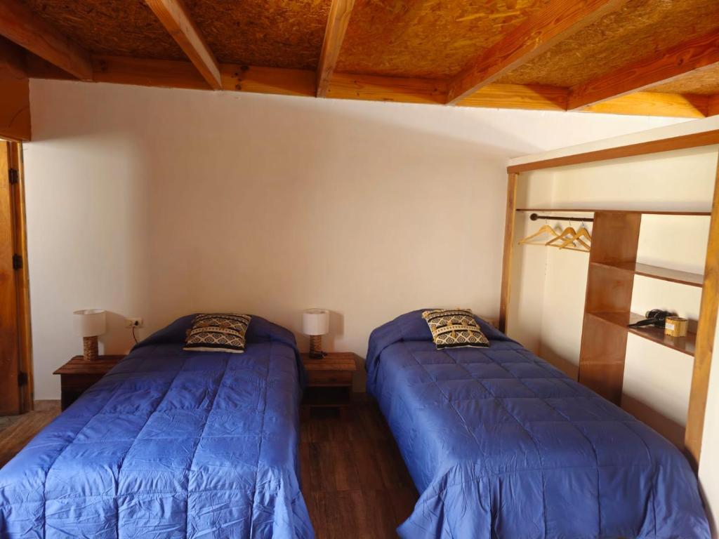 Postel nebo postele na pokoji v ubytování Hostal Belen