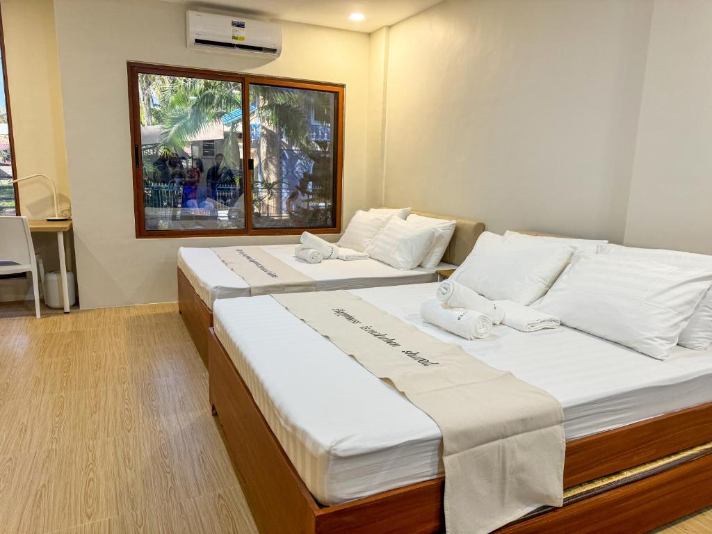 Postel nebo postele na pokoji v ubytování Happynest Rooms in Santa Fe Bantayan Island