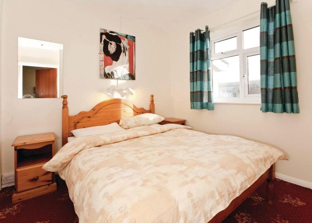 Postel nebo postele na pokoji v ubytování Anglesey Bungalows
