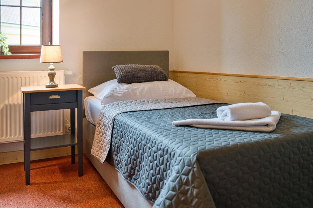 Postel nebo postele na pokoji v ubytování Hotel U Lípy