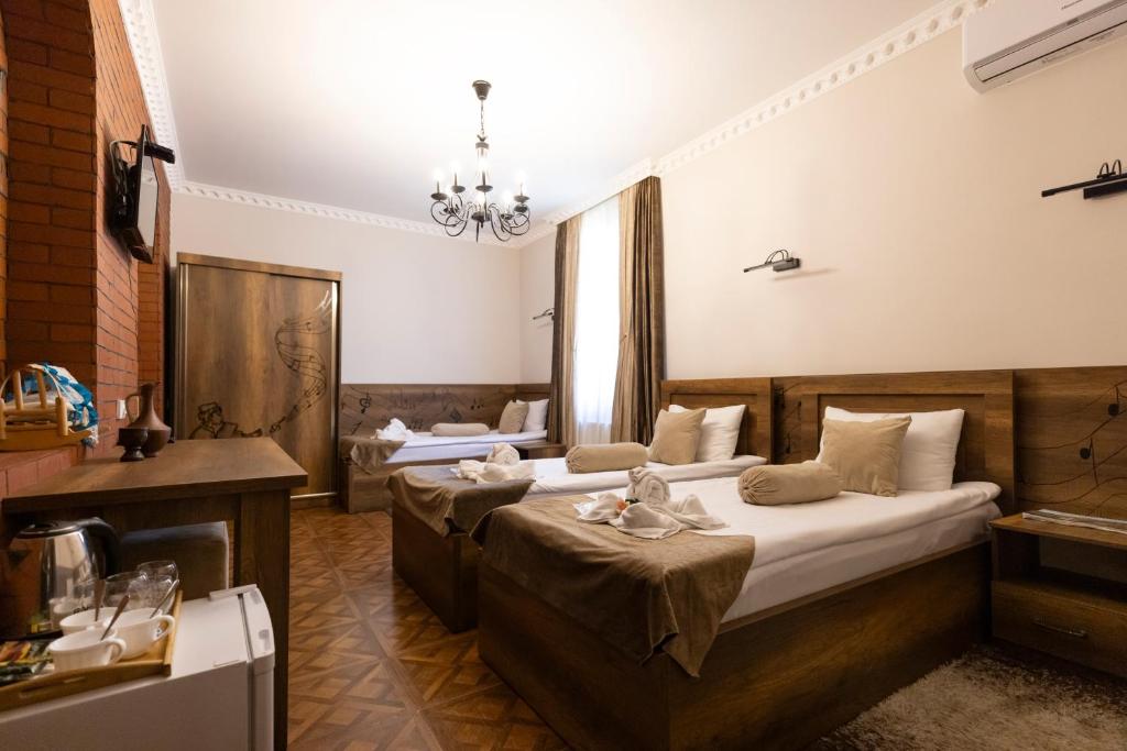 Llit o llits en una habitació de Hestia Boutique Hotel