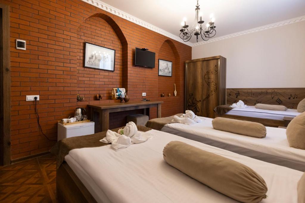 Llit o llits en una habitació de Hestia Boutique Hotel
