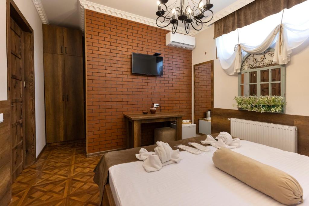 Llit o llits en una habitació de Hestia Boutique Hotel
