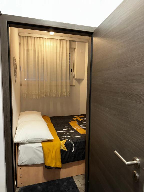 Postel nebo postele na pokoji v ubytování Apartman FOX