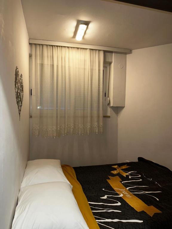 Postel nebo postele na pokoji v ubytování Apartman FOX