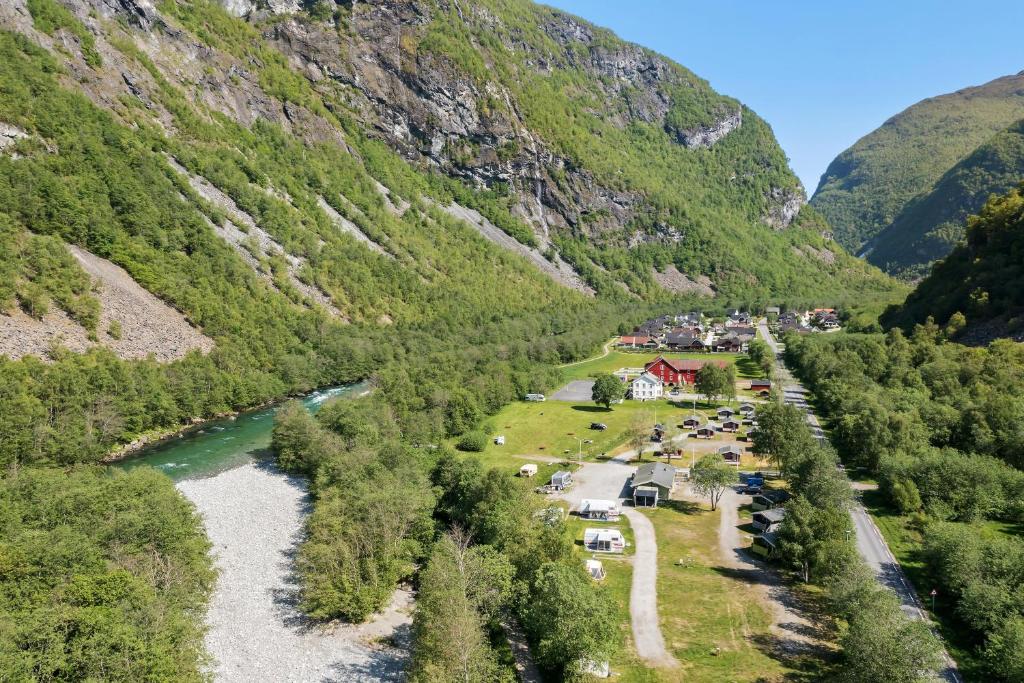 an aerial view of a valley with a river and mountains at Utladalen Camping in Årdal