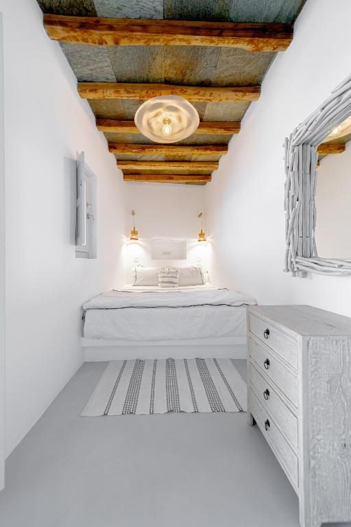 Voodi või voodid majutusasutuse Makarias Traditional Luxury Villas toas