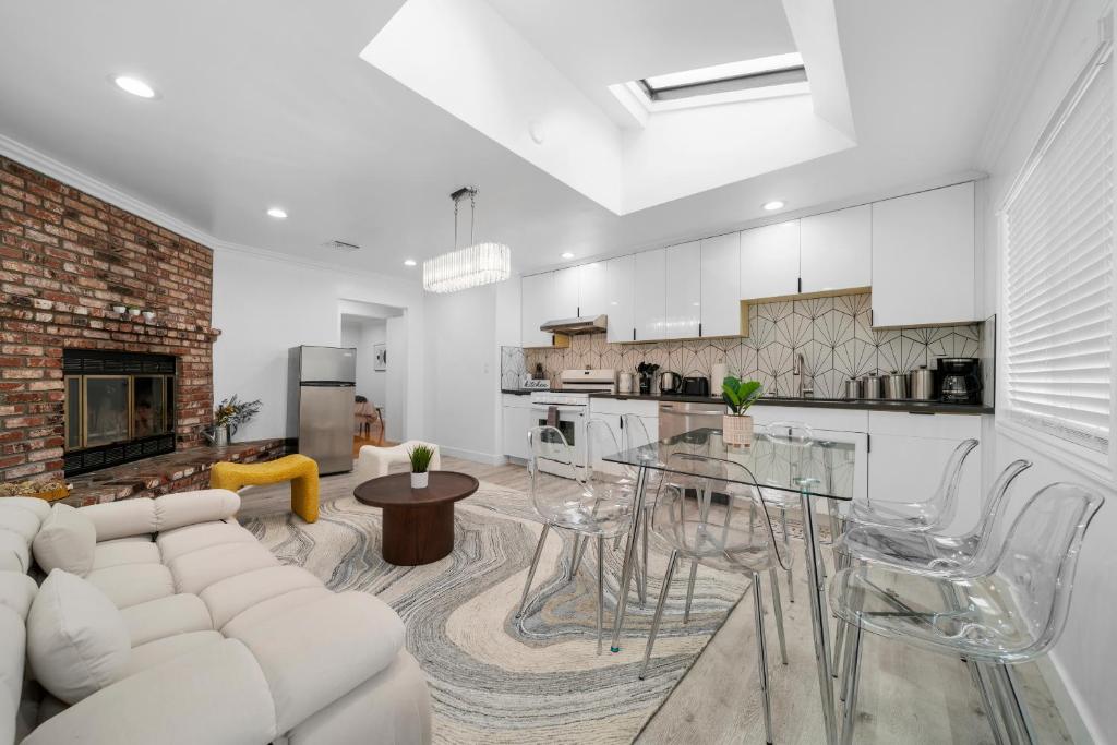 a living room with a white couch and a table at # Marbella Lane - Serene and Pristine 2BR Home in West Covina