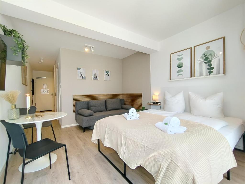 Postel nebo postele na pokoji v ubytování UniverCity Apartment für bis zu 4, Terrasse, Grill