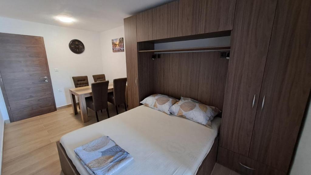 Postel nebo postele na pokoji v ubytování Apartmani Dodig