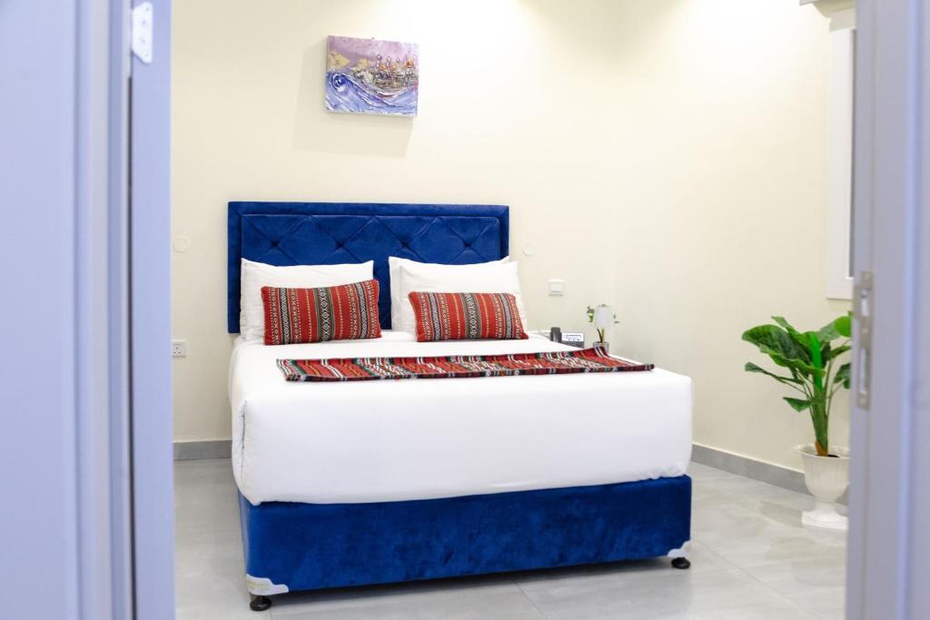 Postel nebo postele na pokoji v ubytování NASEEM HOTEL